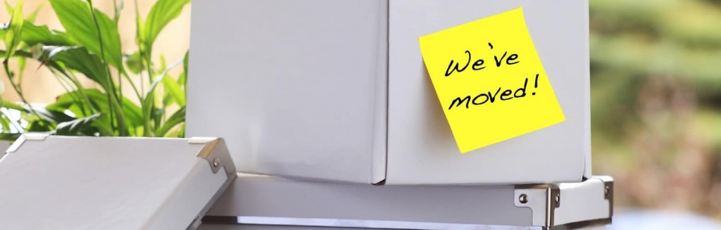 Office box with a sticky note saying we’ve moved illustrates a Commercial Real Estate Group of Tucson blog article.